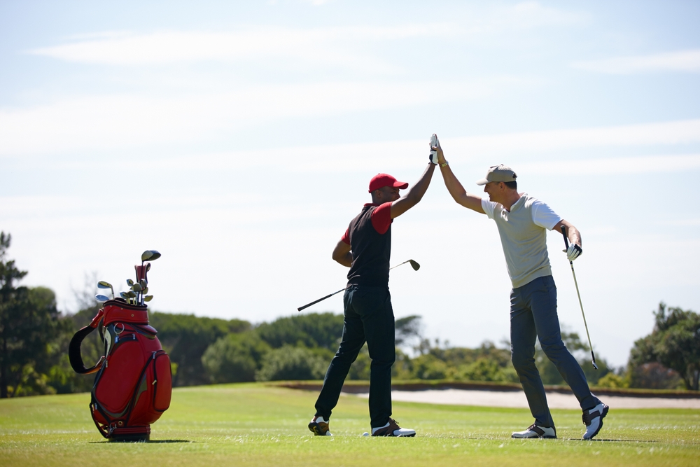 team playing golf