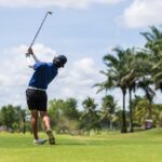 golfer practising his backswing