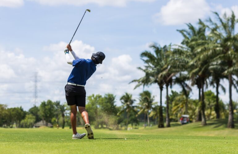 golfer practising his backswing