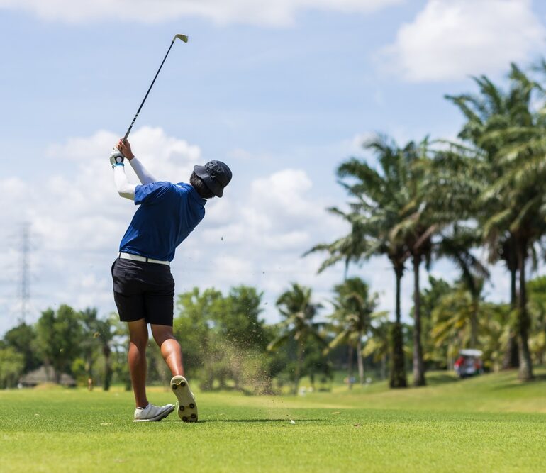 golfer practising his backswing