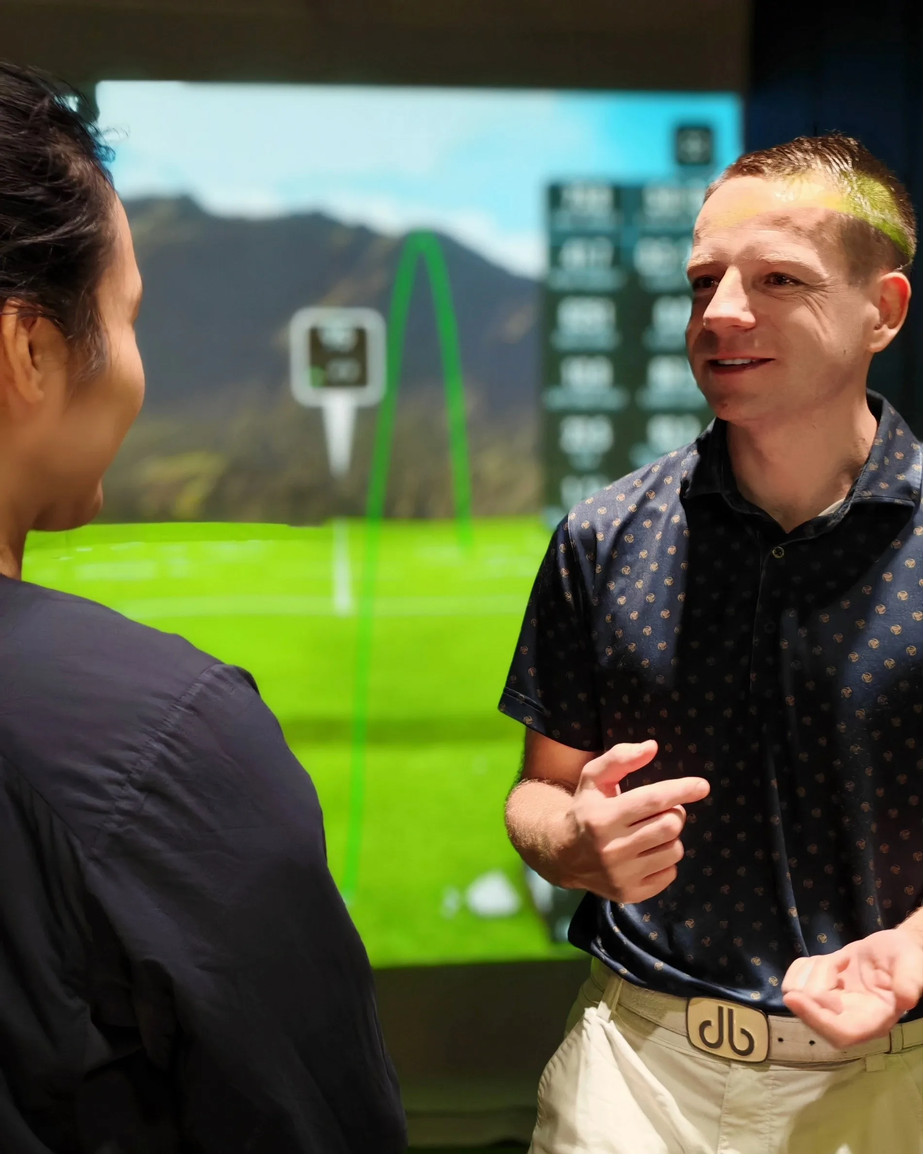 Mike Bennett with student in golf