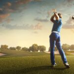 Capture the thrill of golf with this high-resolution image showcasing a golfer in mid-swing on a lush green fairway. The golfer, dressed in modern athletic wear, demonstrates perfect form as they stri